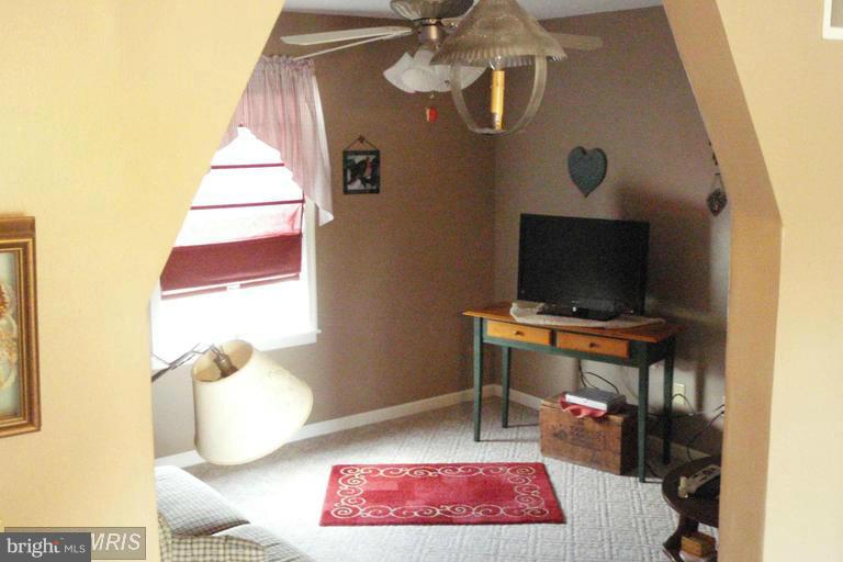 2402 Hoffman Road Greencastle, PA 17225 - Photo 10 of 22 a bedroom with a bed and a flat screen tv