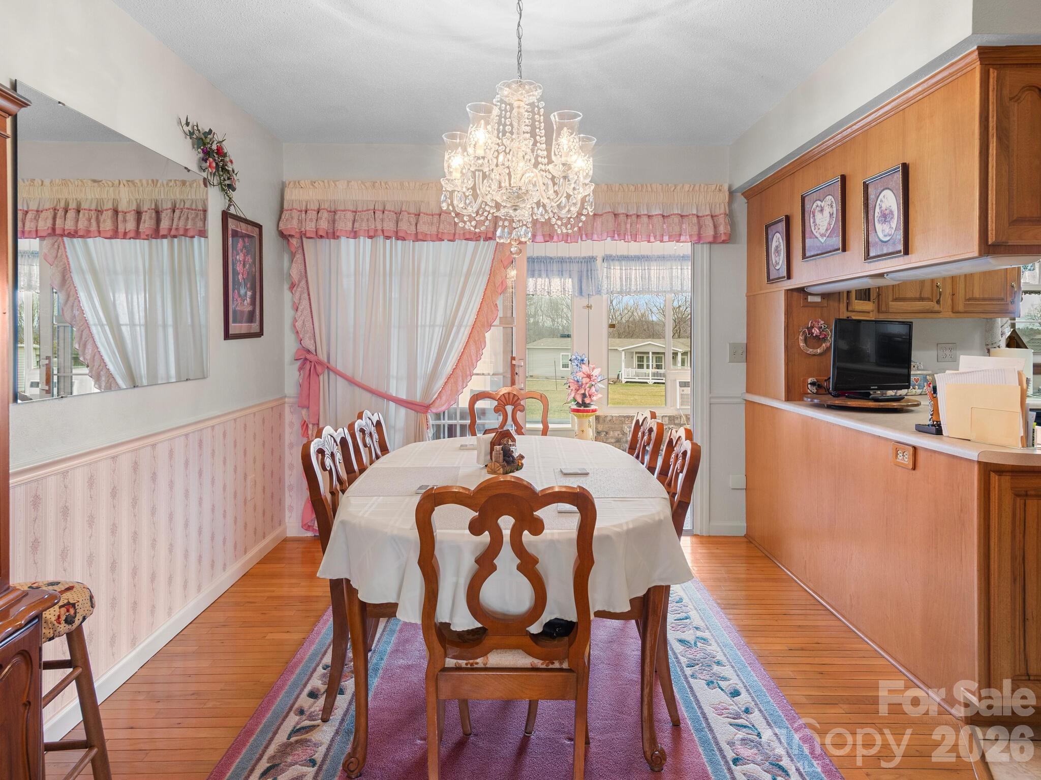 727 Jenkins Valley Road Alexander, NC 28701 - Photo 11 of 48 a living room with furniture and a chandelier