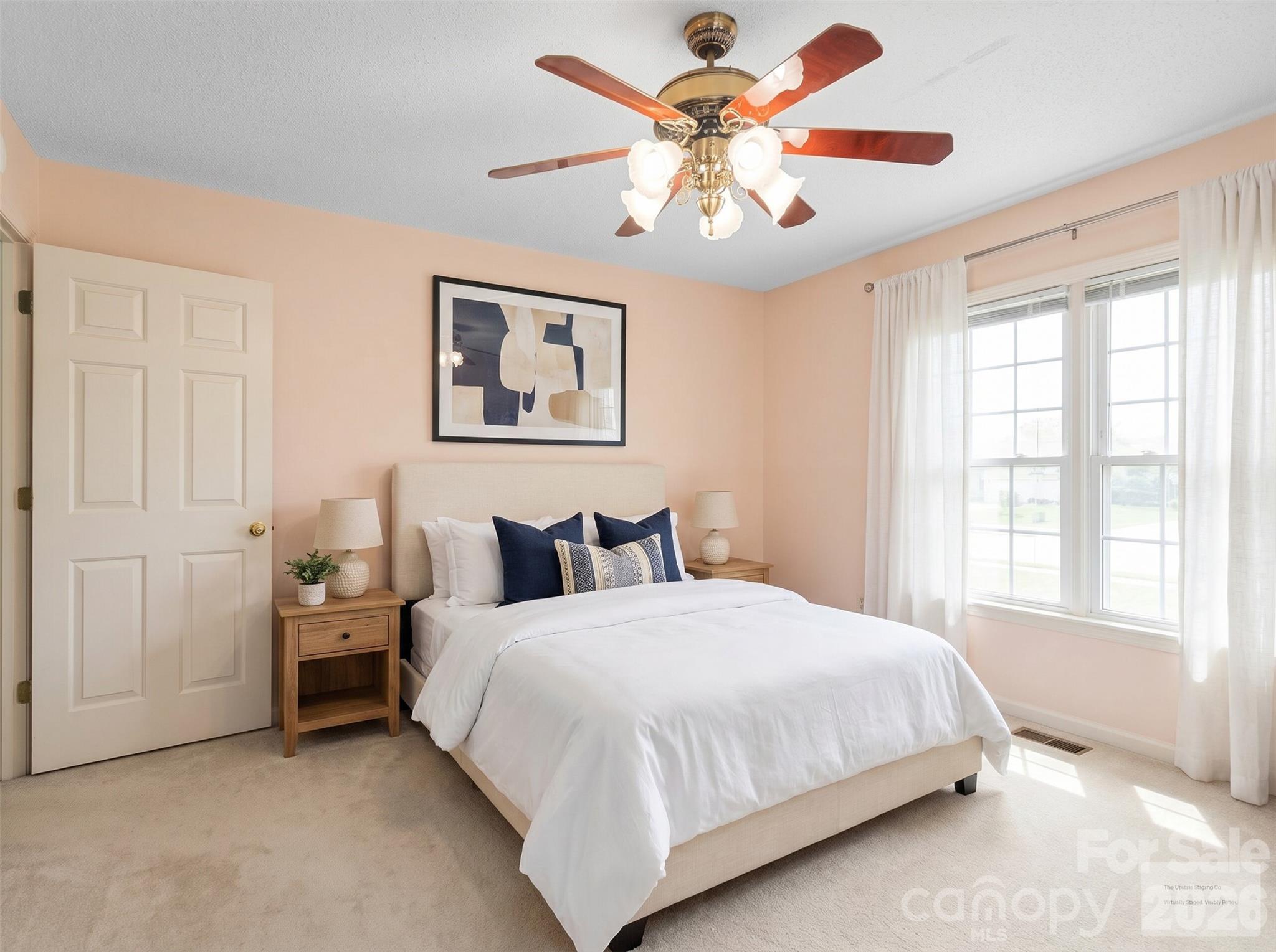 727 Jenkins Valley Road Alexander, NC 28701 - Photo 21 of 48 a bedroom with a bed and a chandelier