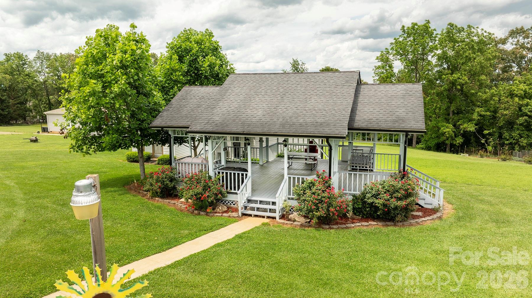 727 Jenkins Valley Road Alexander, NC 28701 - Photo 42 of 48 a view of a house with backyard and sitting area