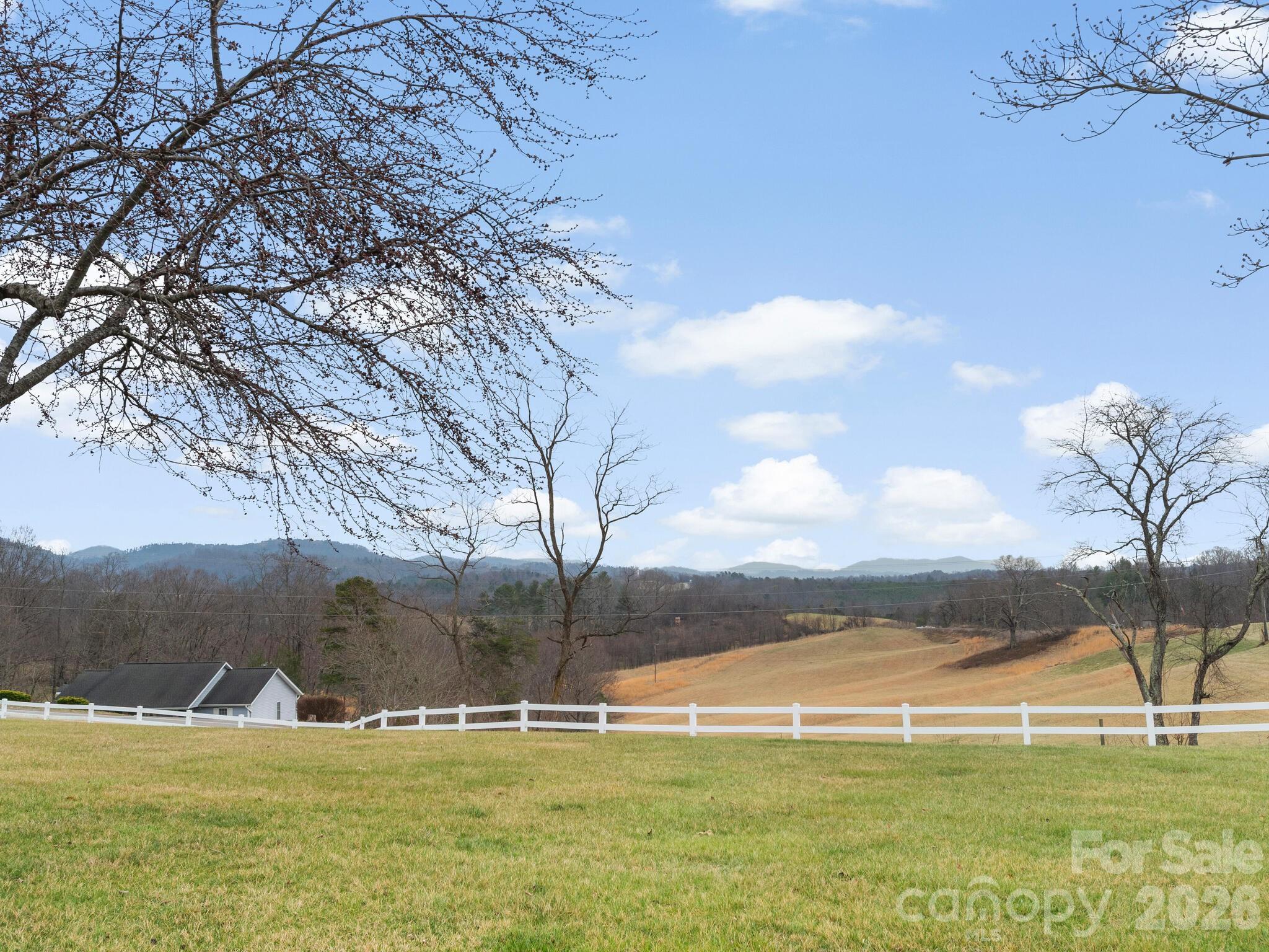 727 Jenkins Valley Road Alexander, NC 28701 - Photo 43 of 48 a view of a swimming pool with an ocean in the background