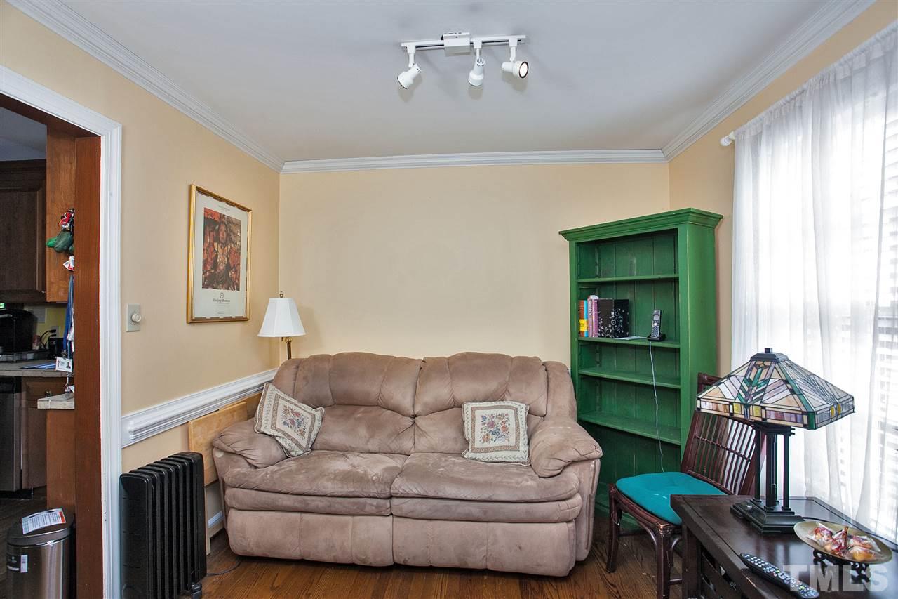 7021 Sandringham Court Raleigh, NC 27613 - Photo 11 of 25 a living room with furniture and a window