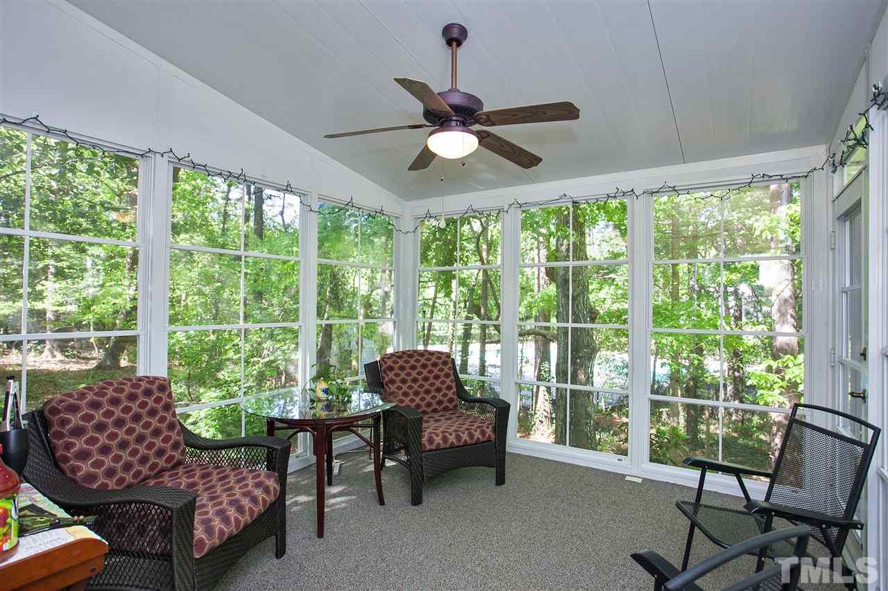 7021 Sandringham Court Raleigh, NC 27613 - Photo 12 of 25 a living room with furniture and a large window