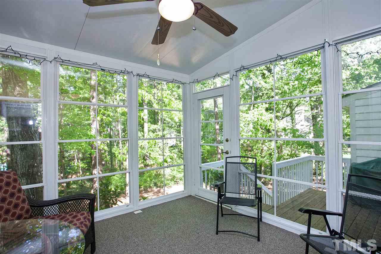 7021 Sandringham Court Raleigh, NC 27613 - Photo 13 of 25 a living room with furniture and a window