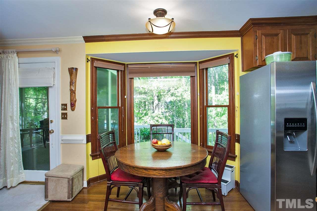 7021 Sandringham Court Raleigh, NC 27613 - Photo 6 of 25 a view of a dining room with furniture window and outside view