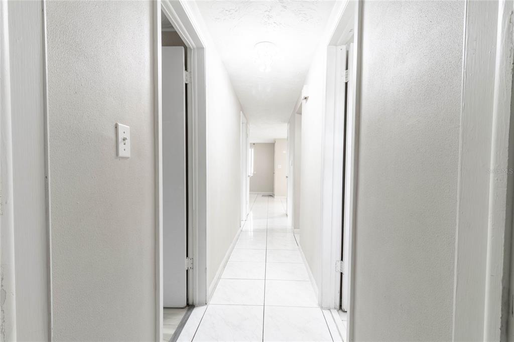 3402 Seffner Drive Holiday, FL 34691 - Photo 17 of 27 a view of a bathroom from the hallway