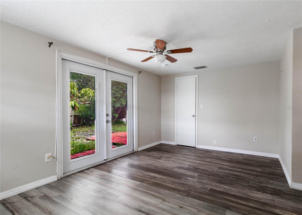 3402 Seffner Drive Holiday, FL 34691 - Photo 19 of 27 a view of an empty room with wooden floor and a window