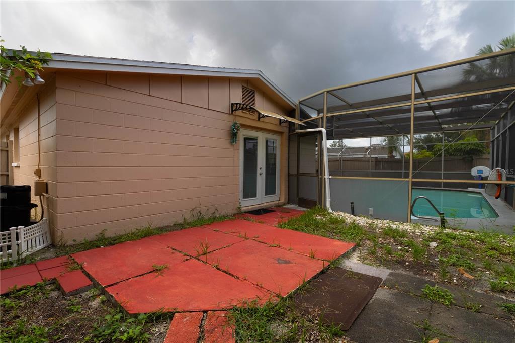 3402 Seffner Drive Holiday, FL 34691 - Photo 22 of 27 a backyard of a house with seating space