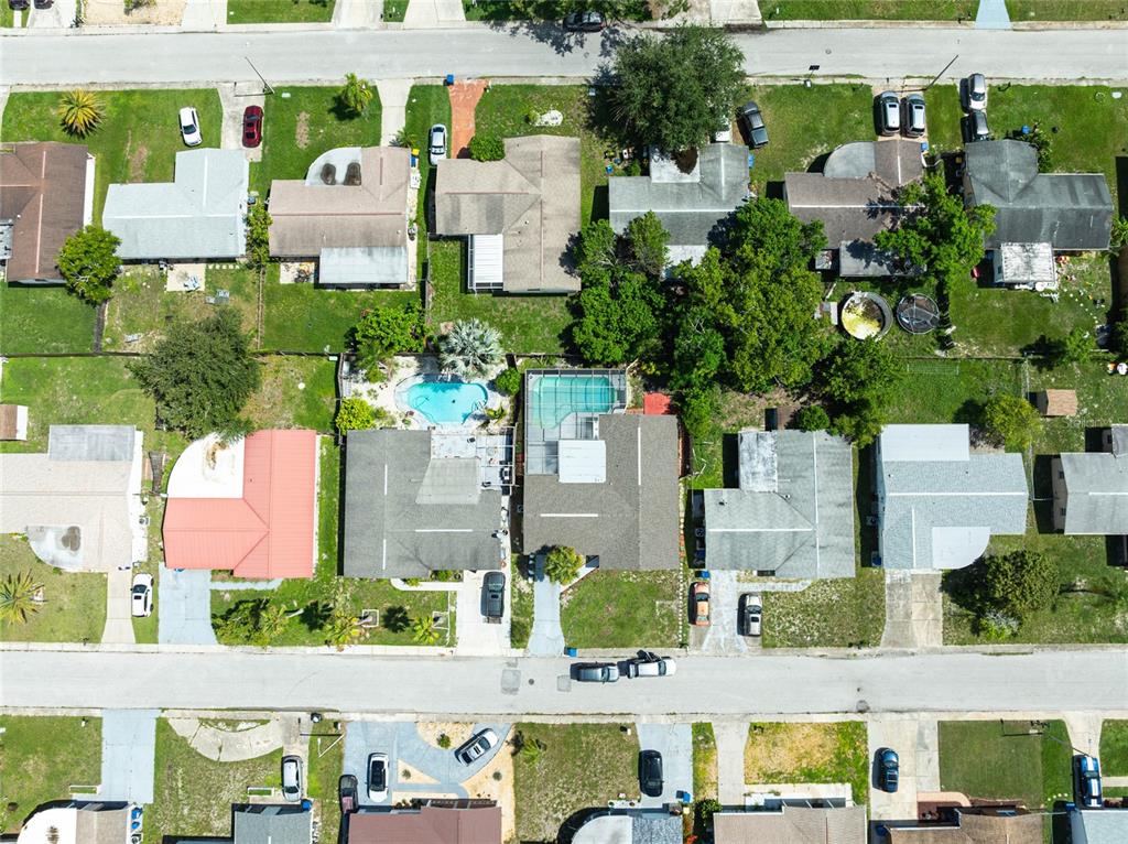3402 Seffner Drive Holiday, FL 34691 - Photo 27 of 27 an aerial view of multiple houses with yard