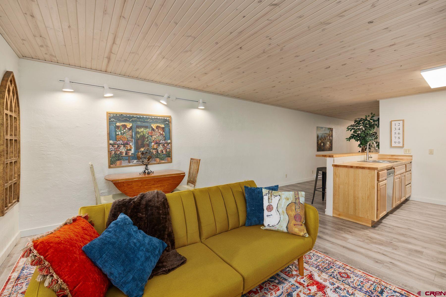 35 Emmons Road, Unit A Crested Butte, CO 81225 - Photo 11 of 28 a living room with furniture and a wooden floor