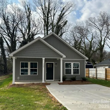 a front view of a house with yard