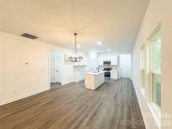a view of kitchen with wooden floor