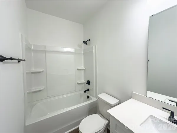 a bathroom with a toilet sink and bathtub