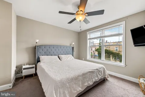 a view of a hallway with a bathroom