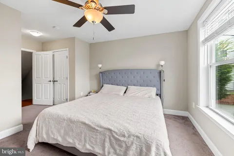 a bedroom with a large bed and a tv