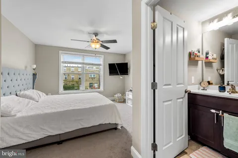 a bedroom with a bed and window