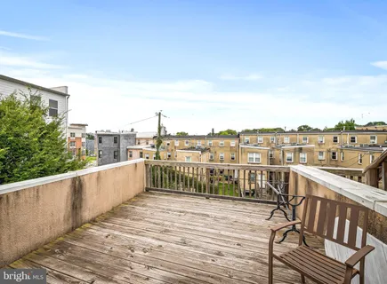 a bathroom with a sink toilet and a mirror