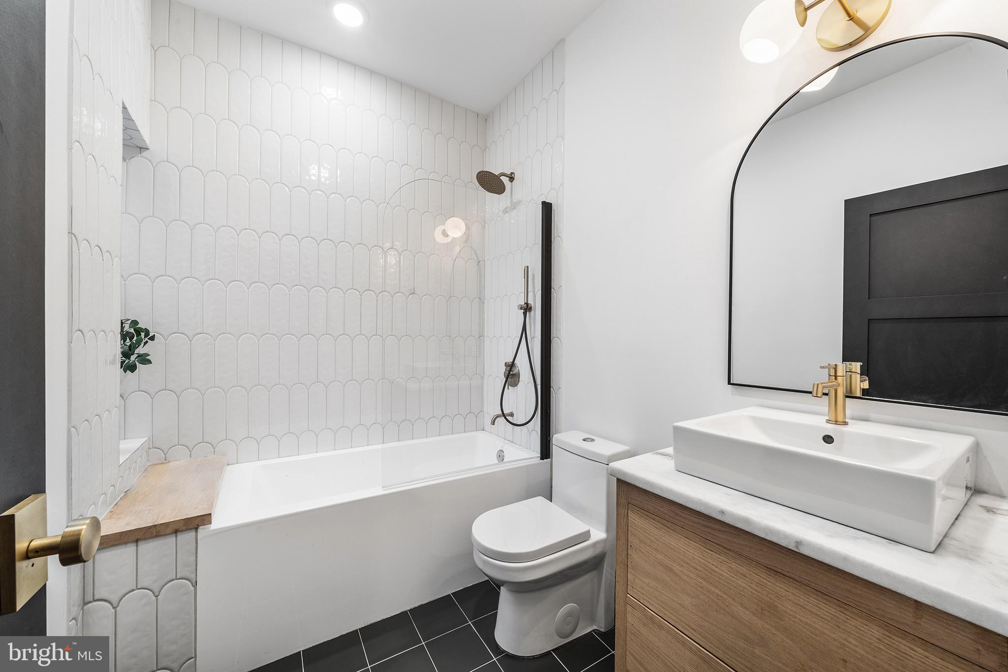 1106 Watkins Street Philadelphia, PA 19148 - Photo 23 of 38 a bathroom with a sink toilet and shower