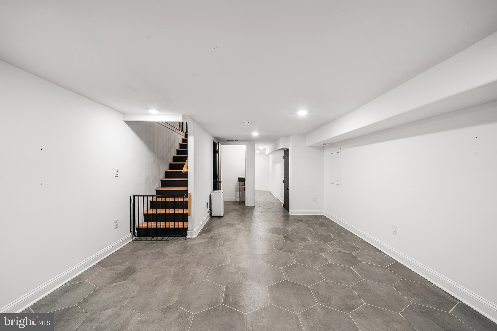1106 Watkins Street Philadelphia, PA 19148 - Photo 31 of 38 an empty room with stairs and furniture