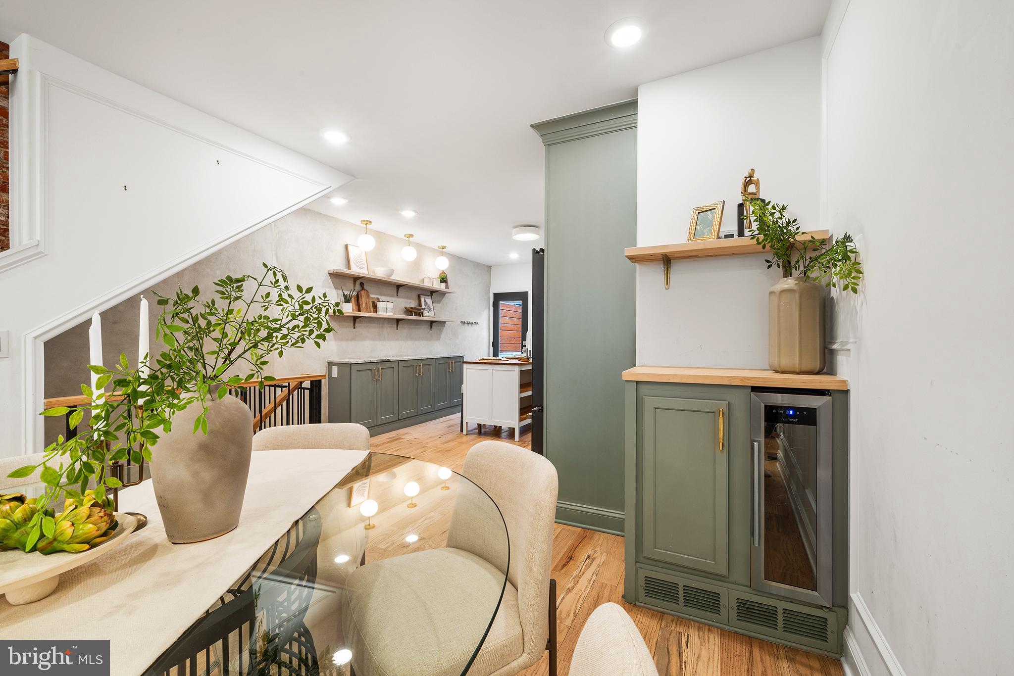 1106 Watkins Street Philadelphia, PA 19148 - Photo 6 of 38 a dining room with furniture and a potted plant