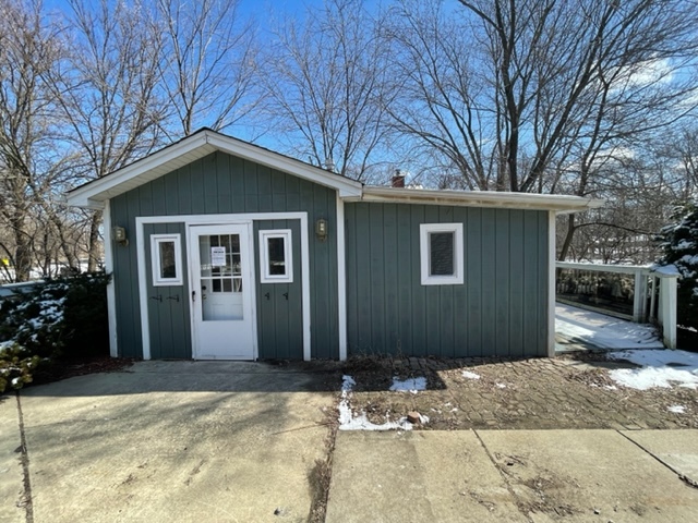 25W271 Foster Avenue Roselle, IL 60172 - Photo 3 of 11 a front view of a house with a yard and garage