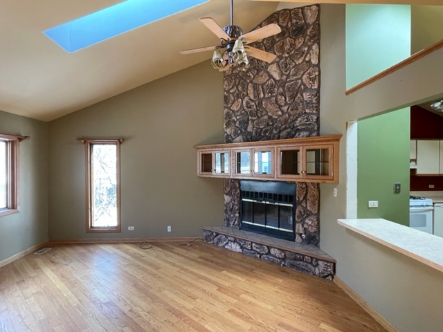 25W271 Foster Avenue Roselle, IL 60172 - Photo 5 of 11 a view of a livingroom with a fireplace and window
