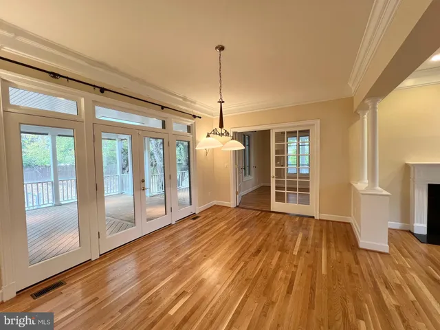 a kitchen with stainless steel appliances granite countertop a sink a stove and a wooden floors