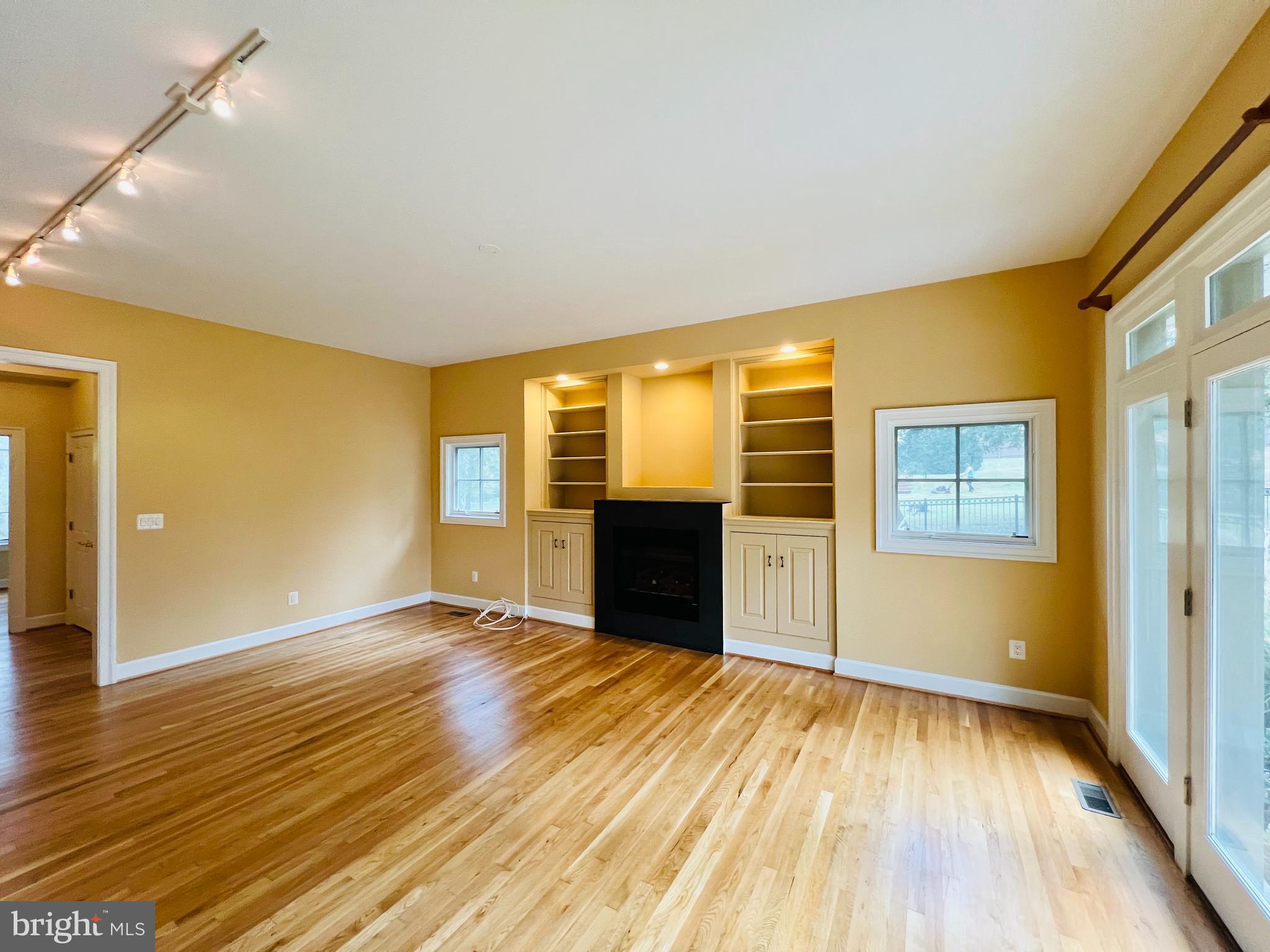 1312 Kurtz Road McLean, VA 22101 - Photo 25 of 62 a view of an empty room with wooden floor and a window