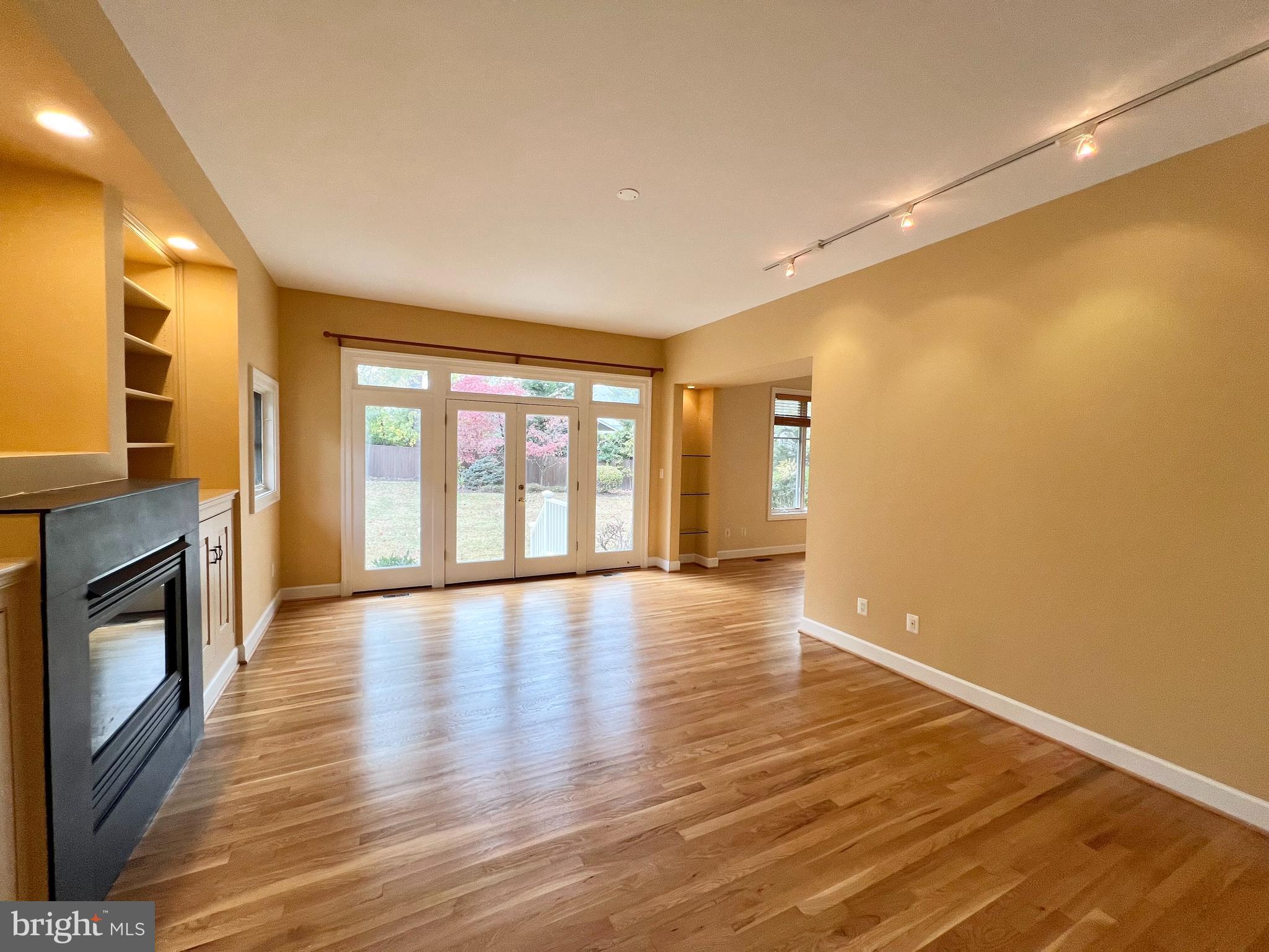 1312 Kurtz Road McLean, VA 22101 - Photo 26 of 62 a view of an empty room with a window and wooden floor