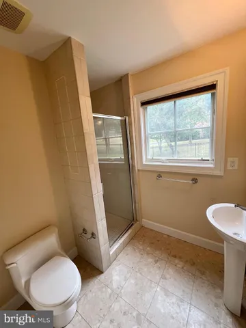 a bathroom with a bathtub sink and vanity