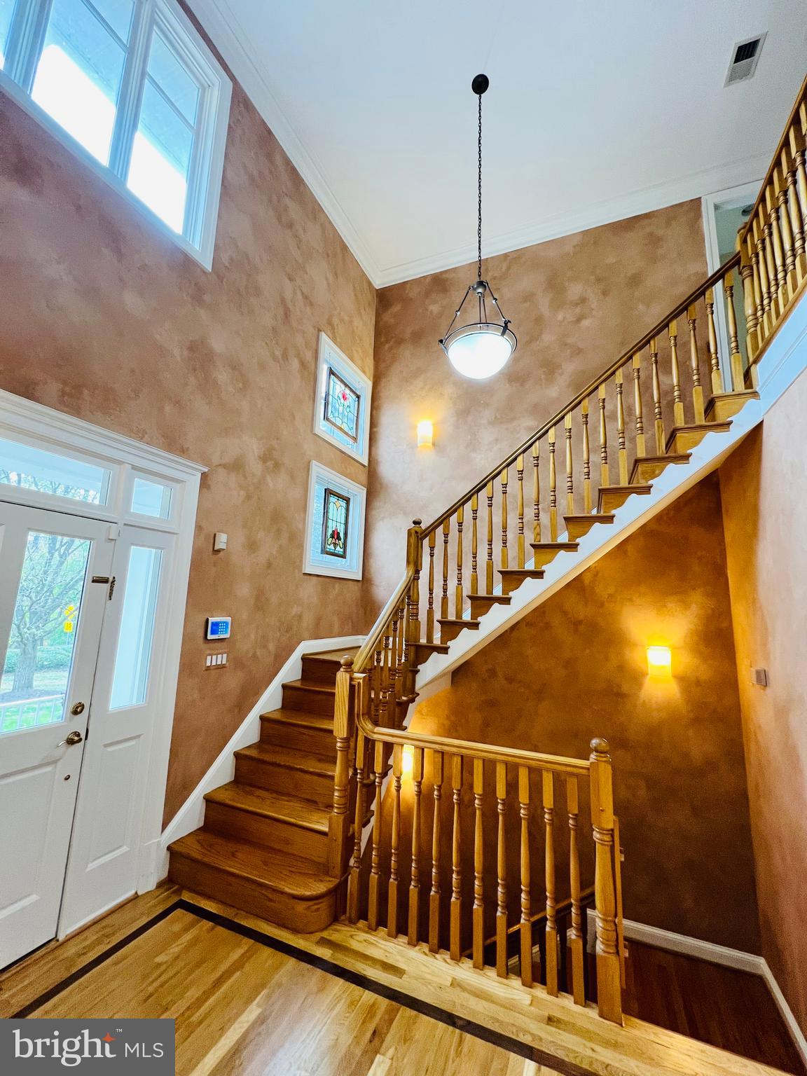 1312 Kurtz Road McLean, VA 22101 - Photo 34 of 62 a view of staircase with railing and a chandelier