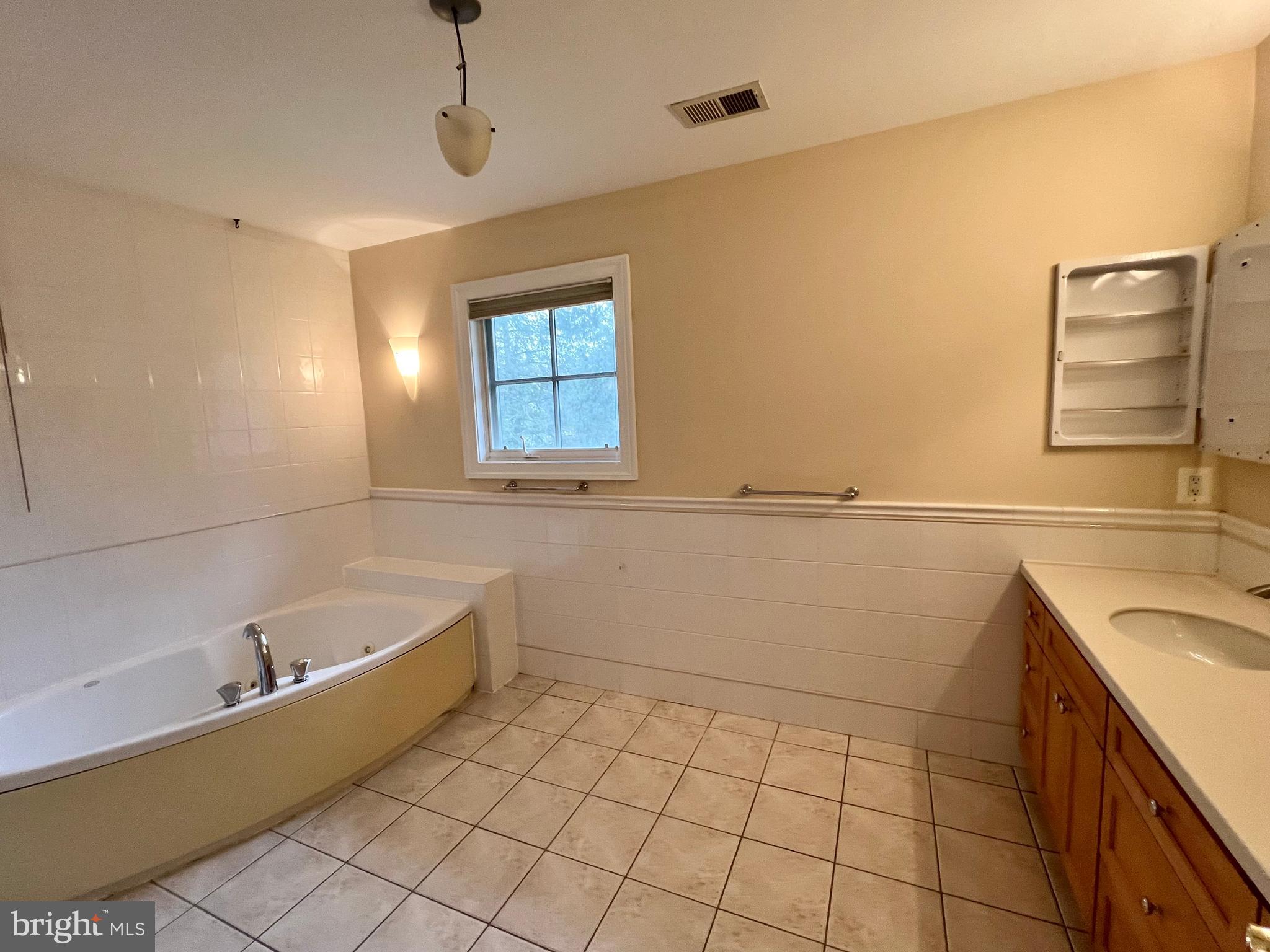 1312 Kurtz Road McLean, VA 22101 - Photo 38 of 62 a bathroom with a bathtub sink and vanity