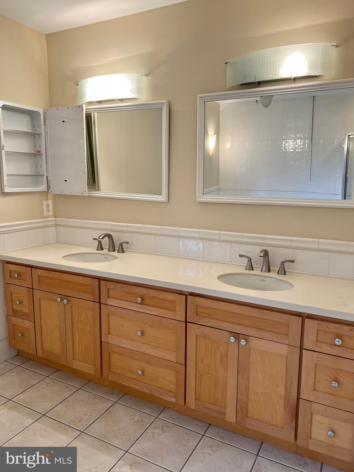 1312 Kurtz Road McLean, VA 22101 - Photo 40 of 62 a bathroom with a granite countertop sink and a mirror