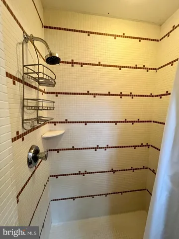 a front view of a house with a yard and a garden