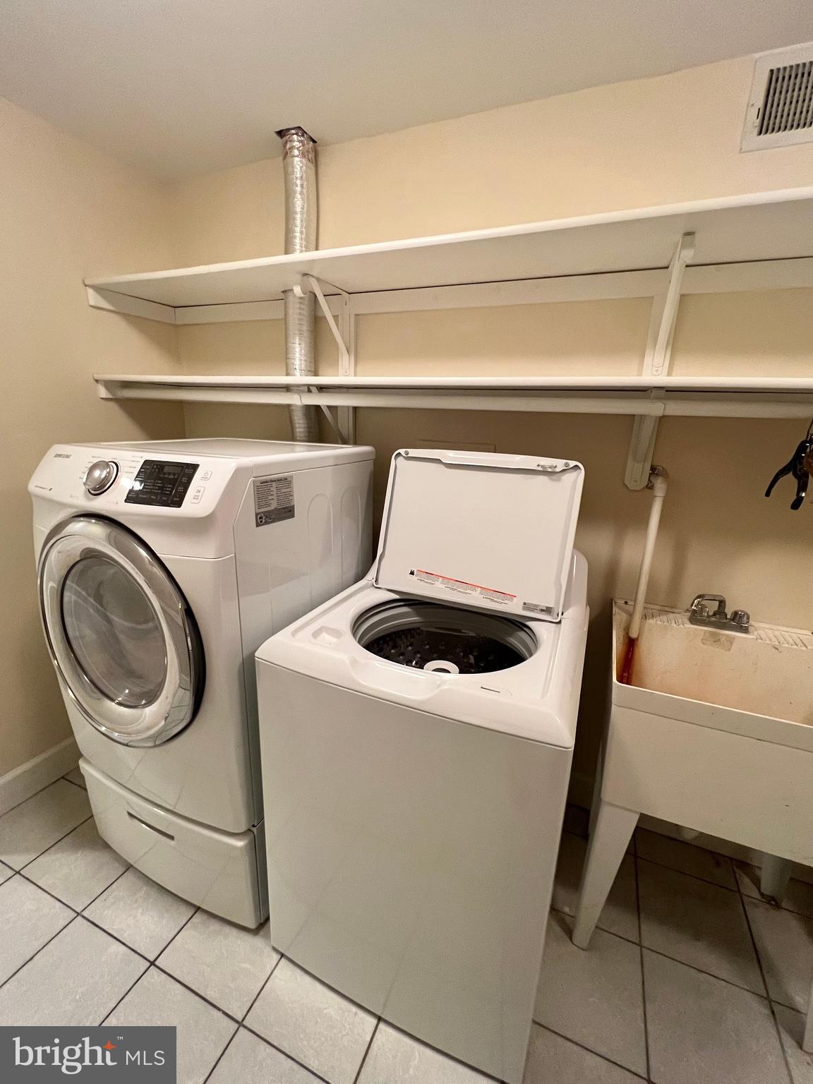 1312 Kurtz Road McLean, VA 22101 - Photo 56 of 62 a utility room with dryer and washer