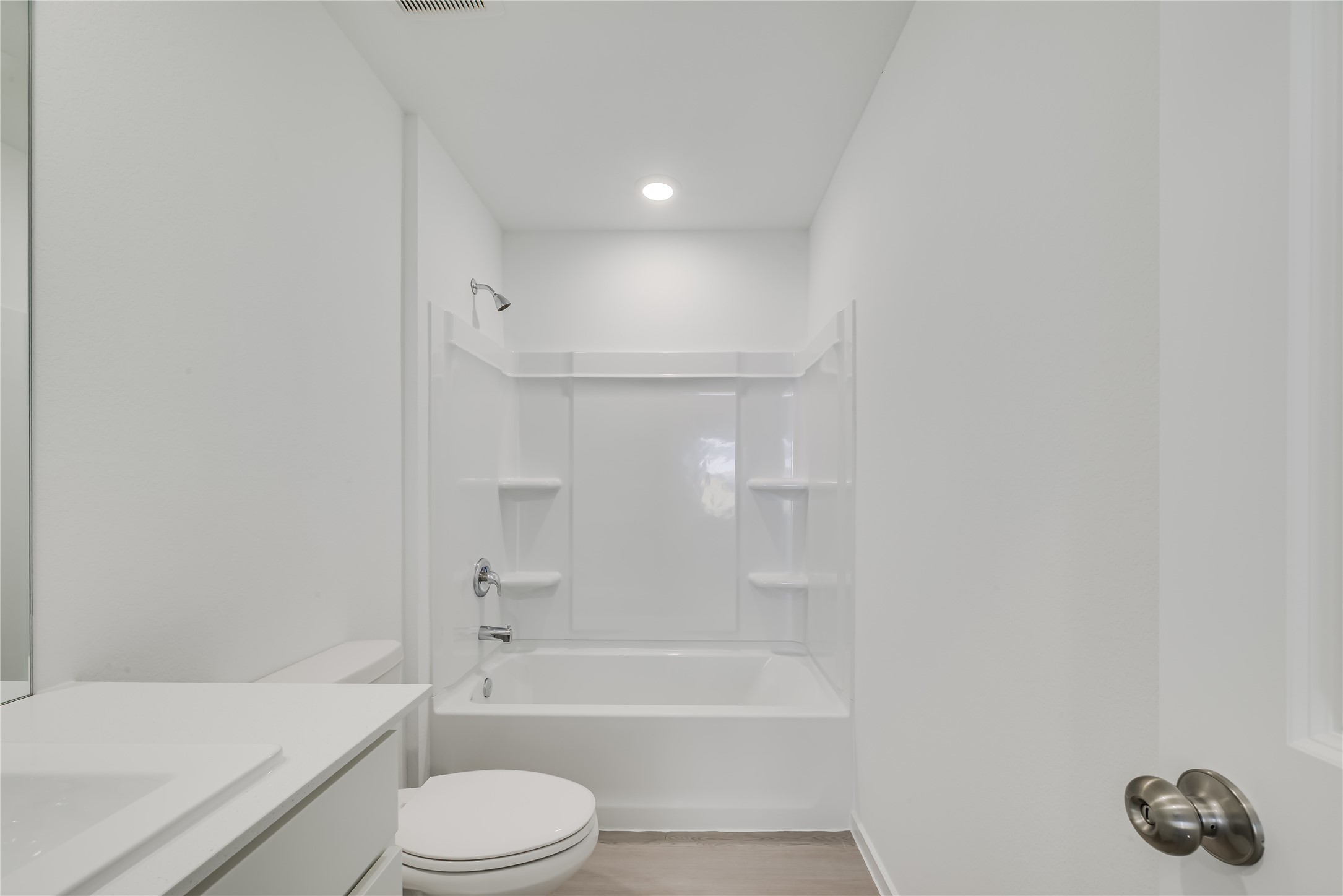 1754 West Stroker Road Crosby, TX 77532 - Photo 21 of 24 a bathroom with a bathtub shower sink vanity and toilet