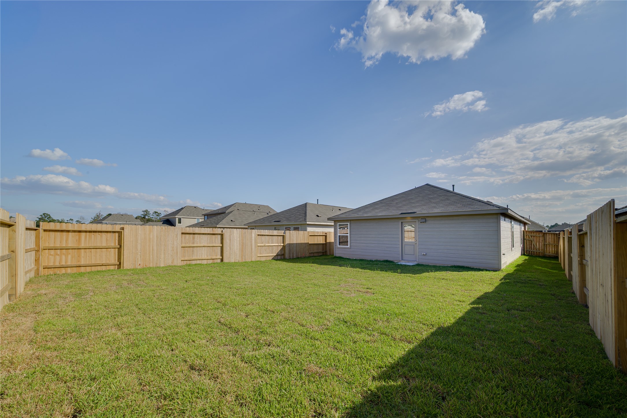 1754 West Stroker Road Crosby, TX 77532 - Photo 24 of 24 a view of a house with a yard and garage