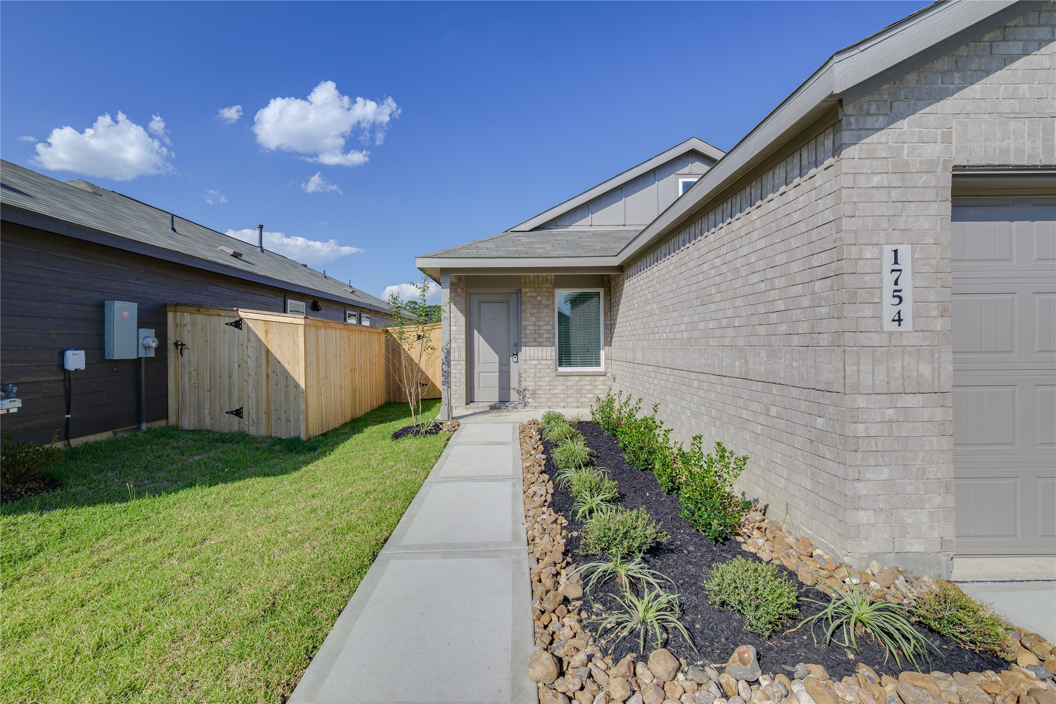 1754 West Stroker Road Crosby, TX 77532 - Photo 3 of 24 a front view of house with a garden