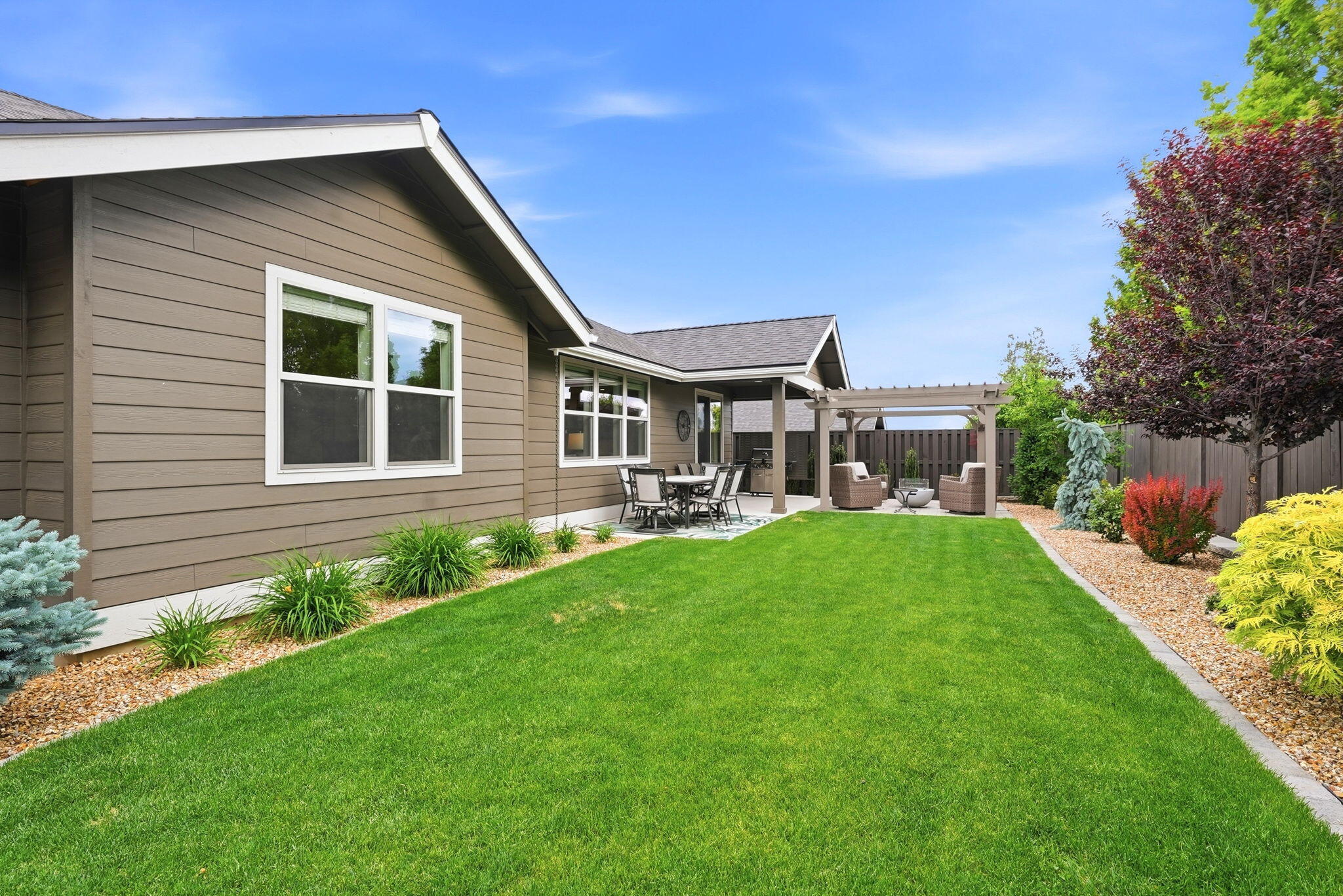 2714 Northwest 23rd Street Redmond, OR 97756 - Photo 44 of 57 a front view of a house with a yard