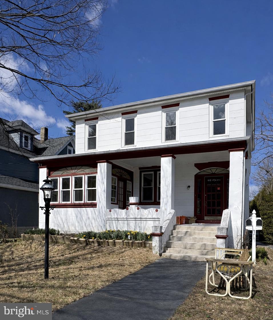 Charming two-story home with porch.