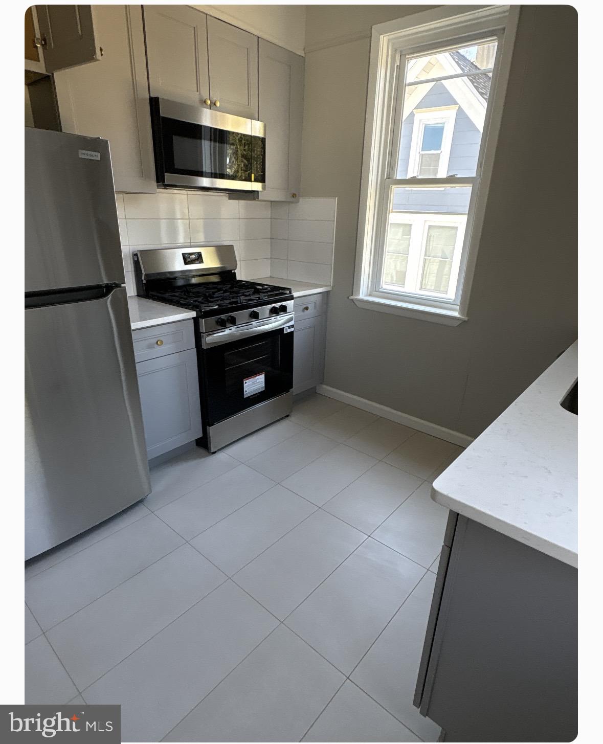 109 Union Avenue Stratford, NJ 08084 - Photo 3 of 10 Modern kitchen with sleek finishes.