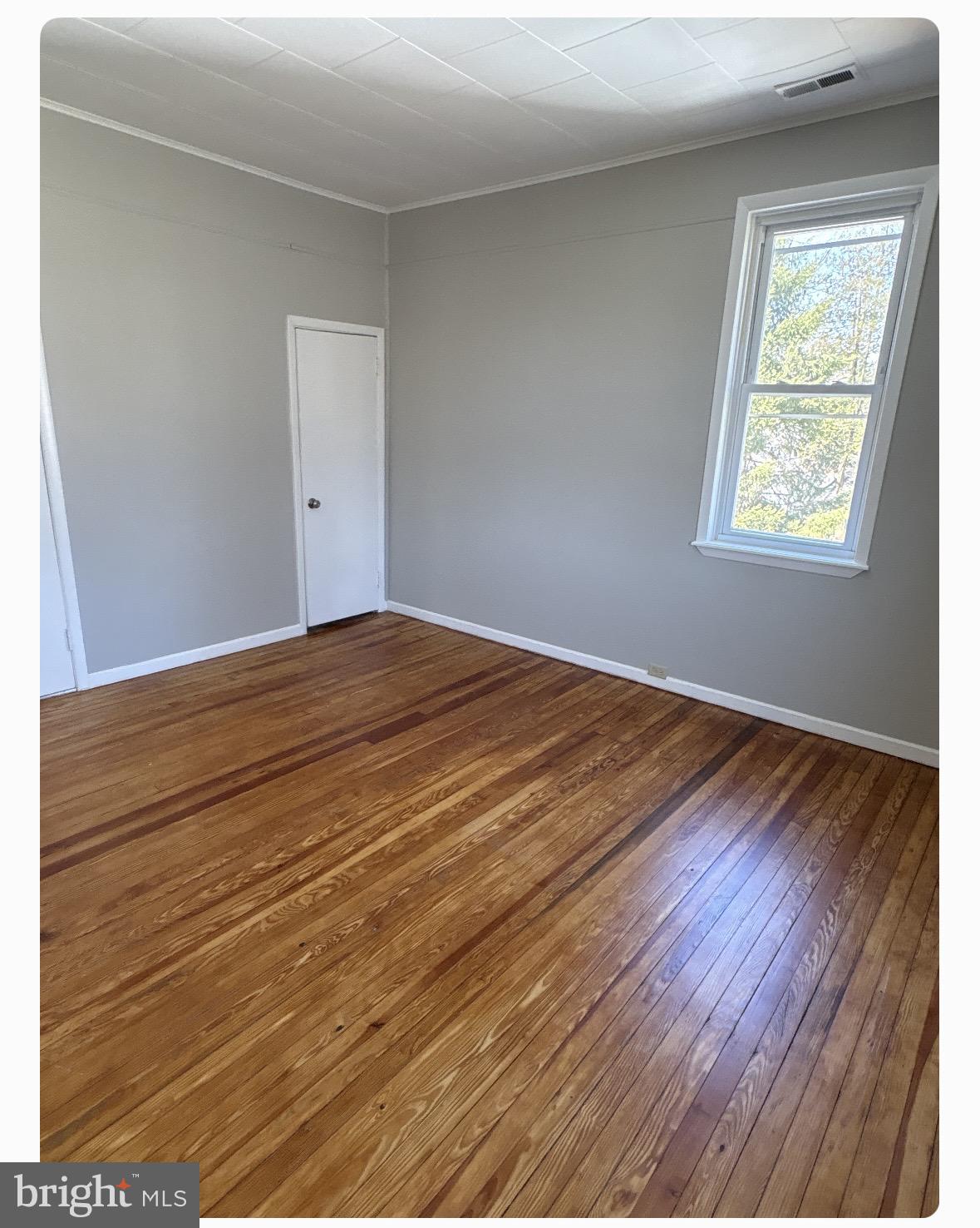 109 Union Avenue Stratford, NJ 08084 - Photo 4 of 10 Bright and airy room with hardwood floors.