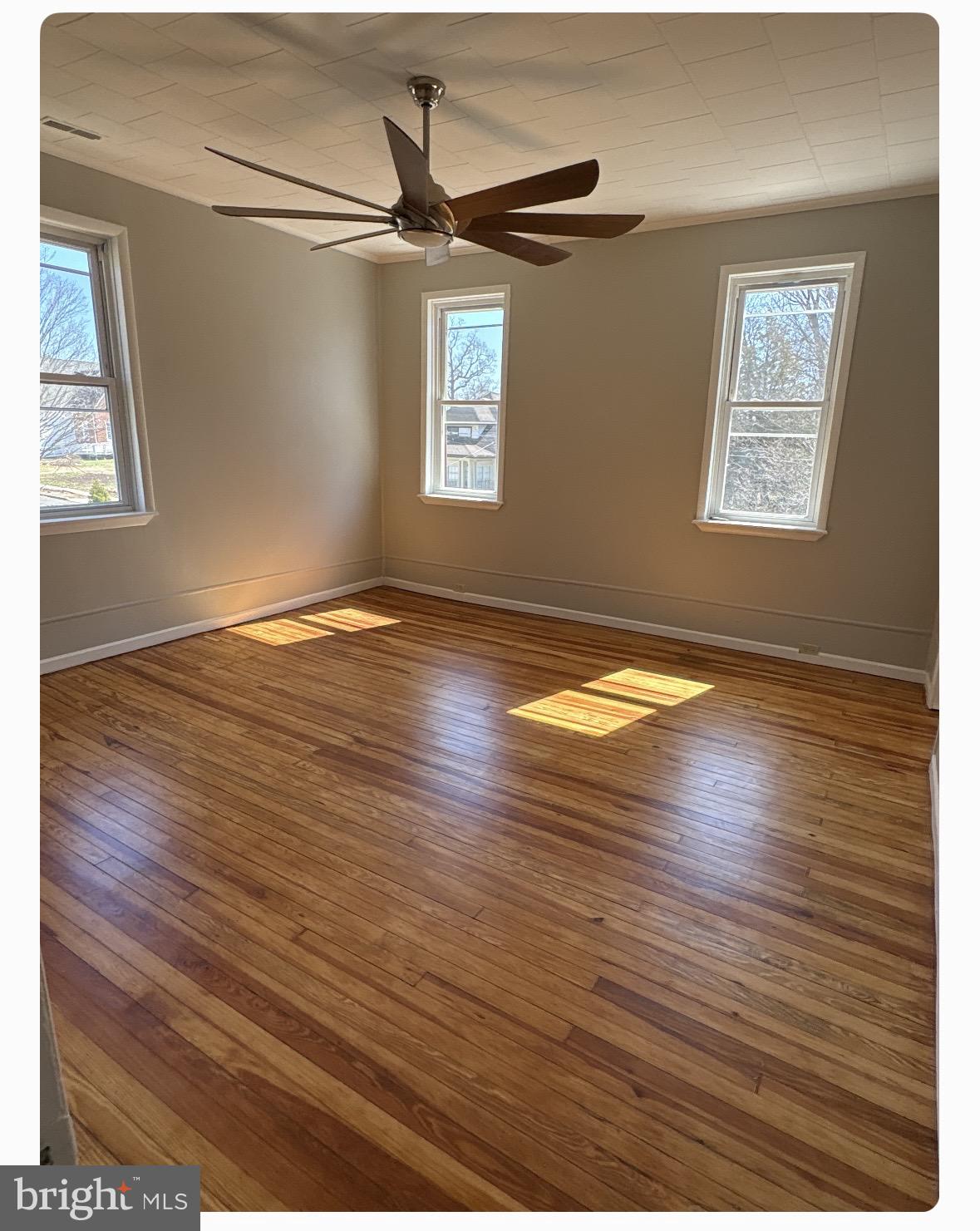 109 Union Avenue Stratford, NJ 08084 - Photo 6 of 10 Sunlit room with warm wooden floors.