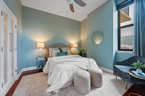 a bedroom with a bed and window