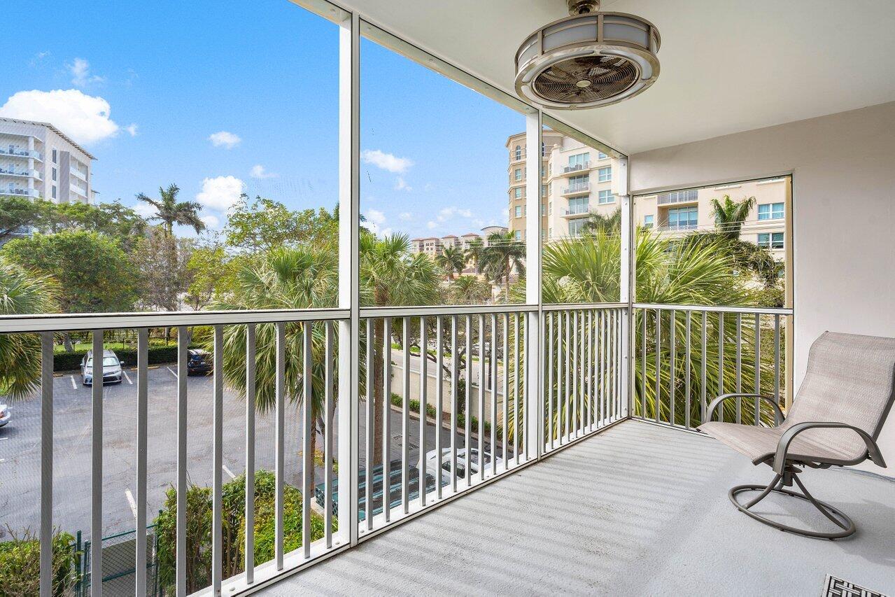 200 East Royal Palm Road, Unit 3120 Boca Raton, FL 33432 - Photo 16 of 27 a view of a balcony with furniture and floor to ceiling window