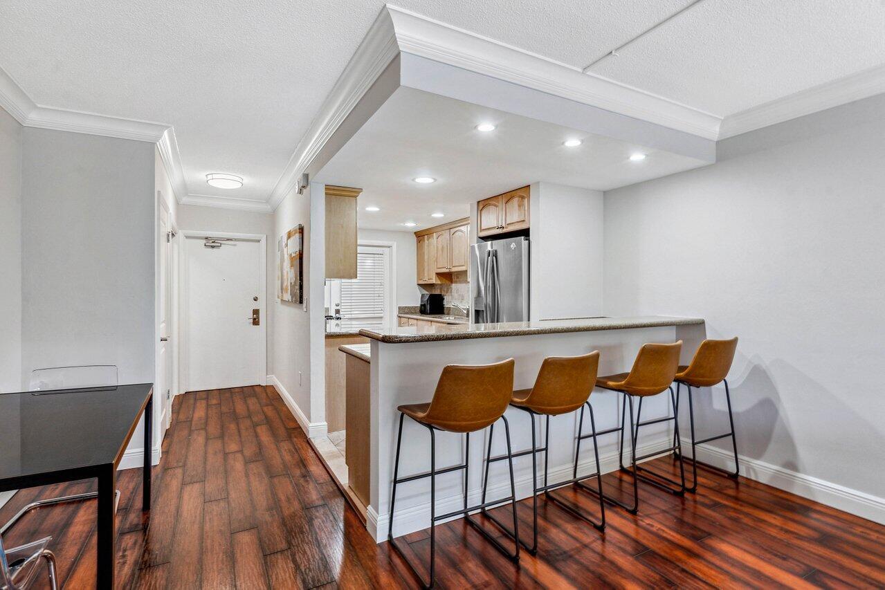200 East Royal Palm Road, Unit 3120 Boca Raton, FL 33432 - Photo 4 of 27 a kitchen with stainless steel appliances granite countertop a stove a sink and a refrigerator
