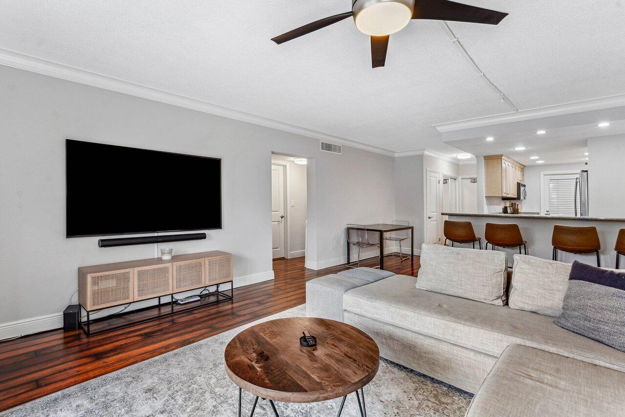 200 East Royal Palm Road, Unit 3120 Boca Raton, FL 33432 - Photo 8 of 27 a living room with furniture and a flat screen tv