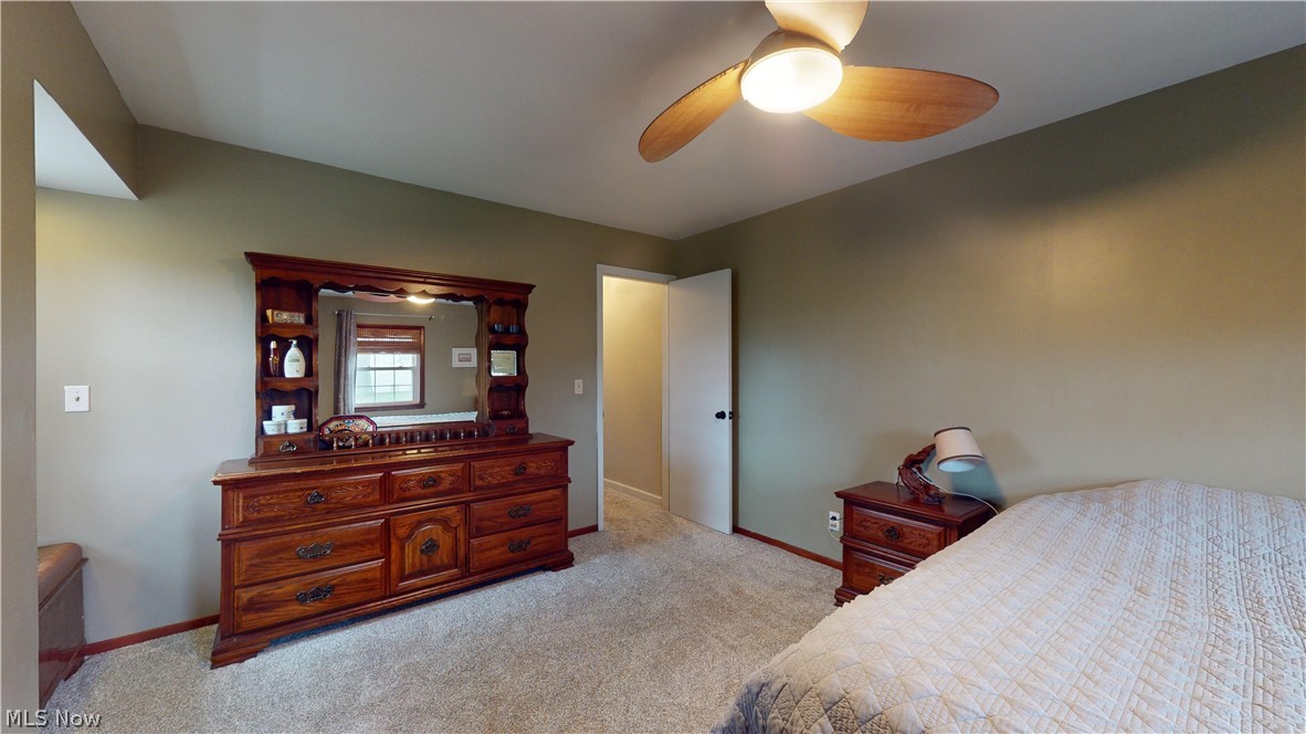 12326 Huntoon Road Painesville, OH 44077 - Photo 23 of 38 Bedroom featuring ceiling fan and light carpet