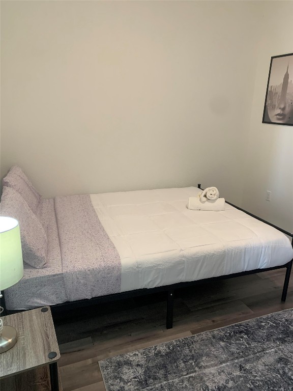 911 West 22nd Street, Unit 305 Austin, TX 78705 - Photo 15 of 15 a bed sitting in a bedroom next to a window