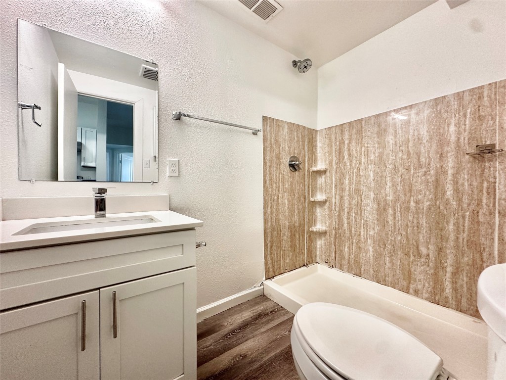 911 West 22nd Street, Unit 305 Austin, TX 78705 - Photo 5 of 15 a bathroom with a sink toilet and shower